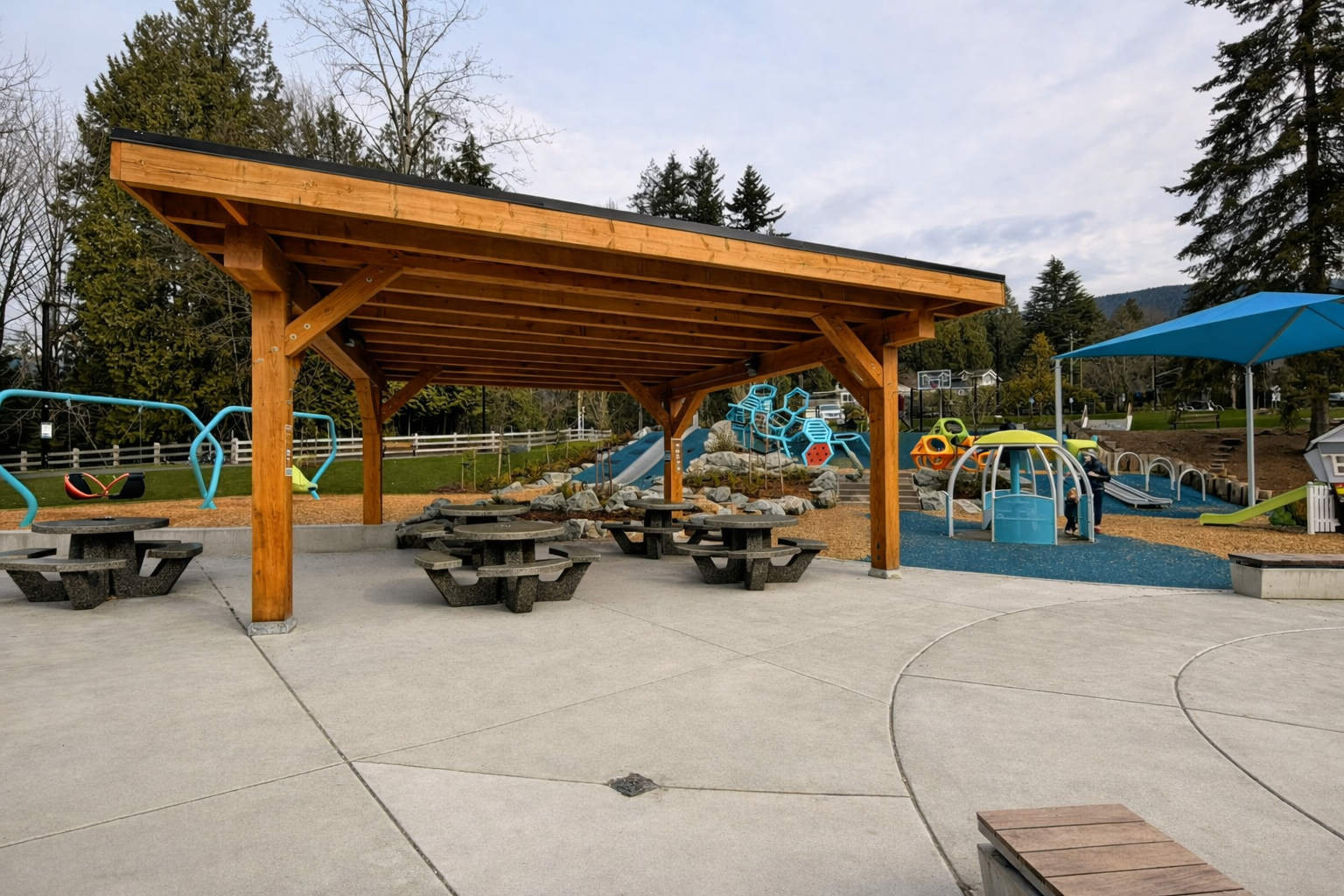 Timber picnic shelter at community playground