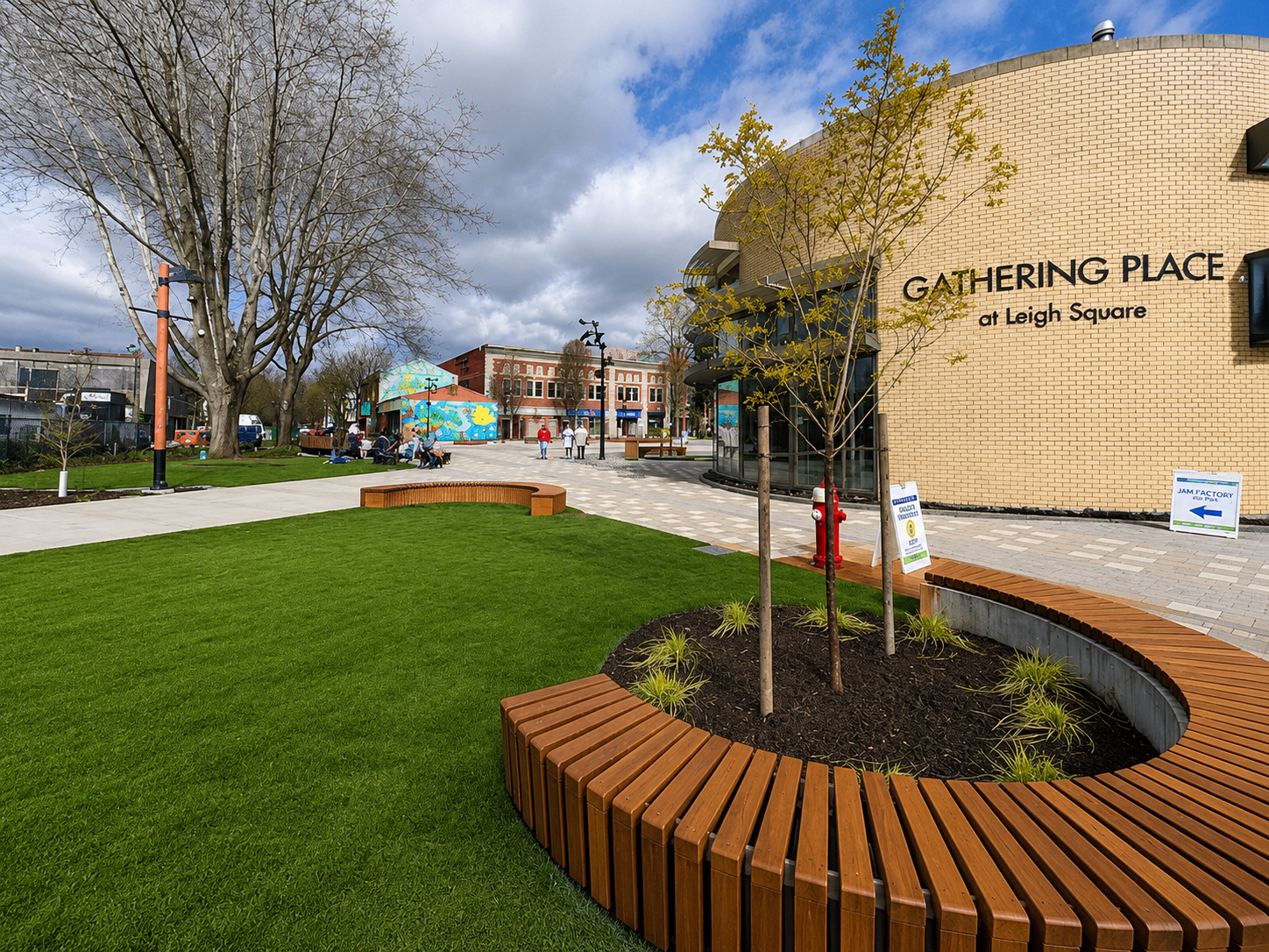 Gathering Place at Leigh Square with curved bench and green lawn