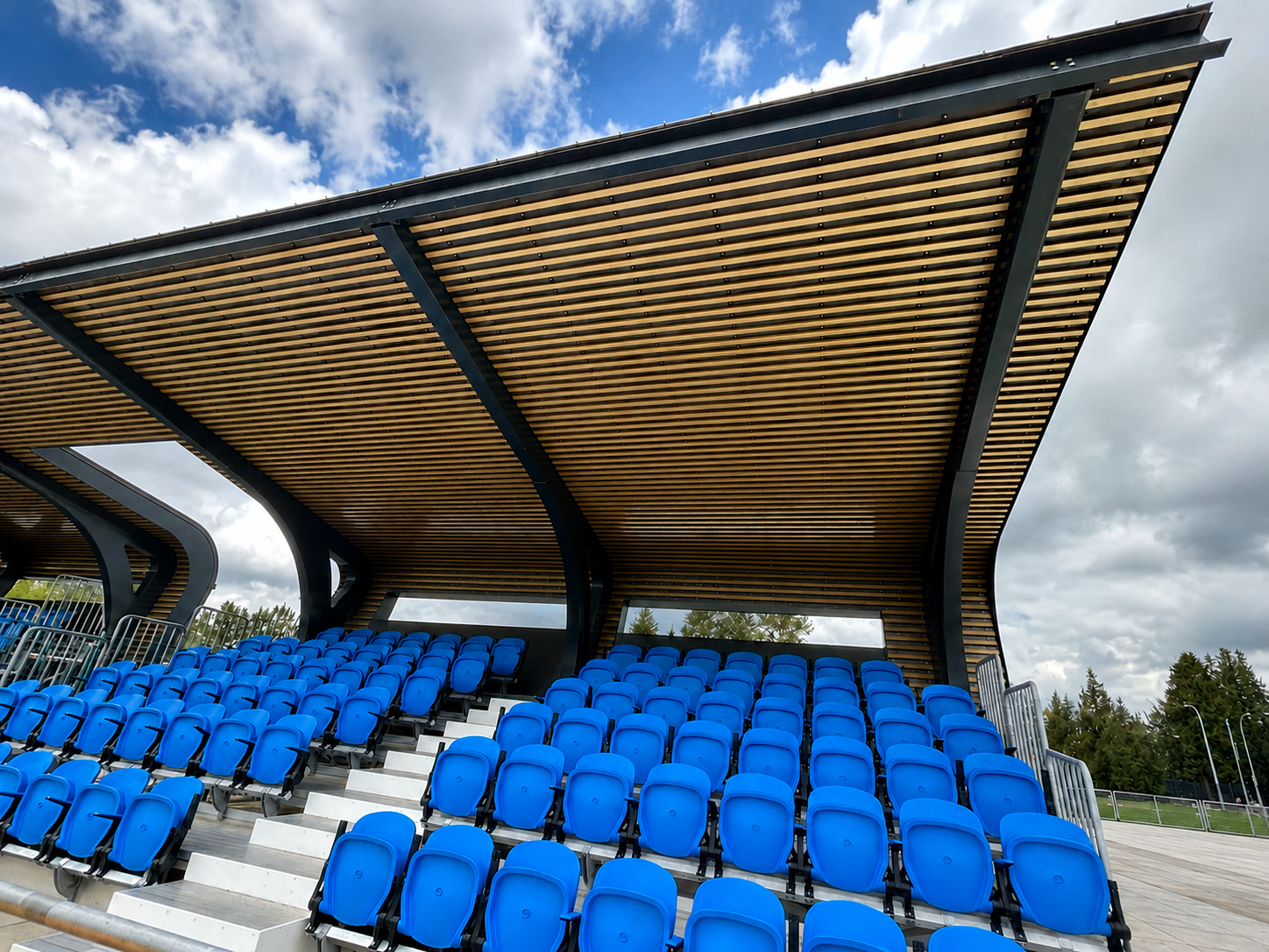 Covered grandstand with blue stadium seating